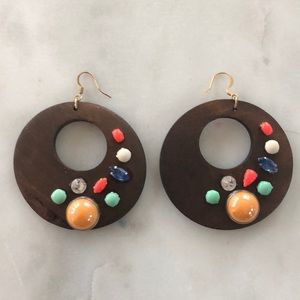 Brand new colorful beaded earrings on wood